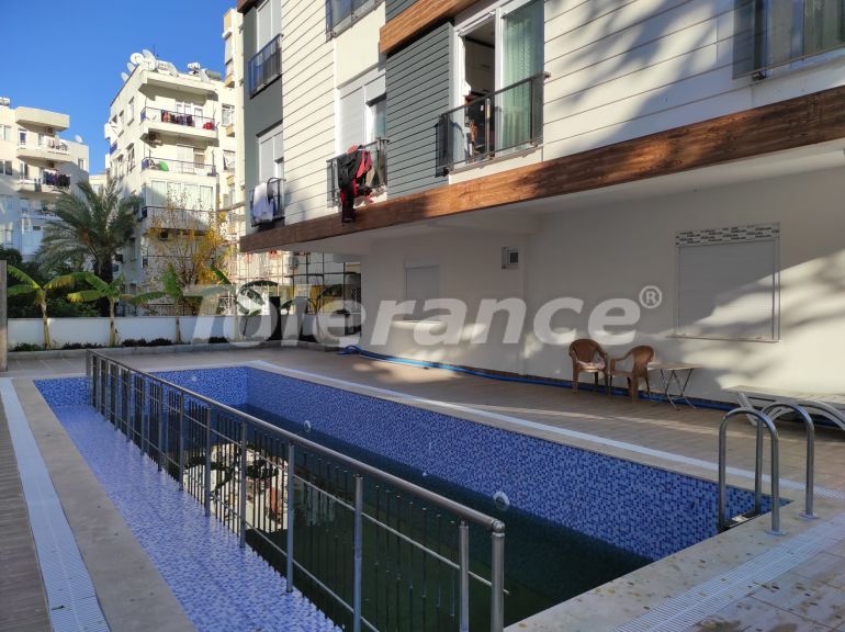 Resale apartment in Muratpaşa, Antalya with furniture and appliances in a complex with a swimming pool - 48231 | Tolerance Homes