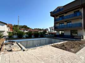 Apartment from developer in Aslanbudcak, Kemer with pool - buy realty in Turkey - 143172
