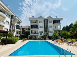 Appartement in Arslanbucak, Kemer zwembad - onroerend goed kopen in Turkije - 107023